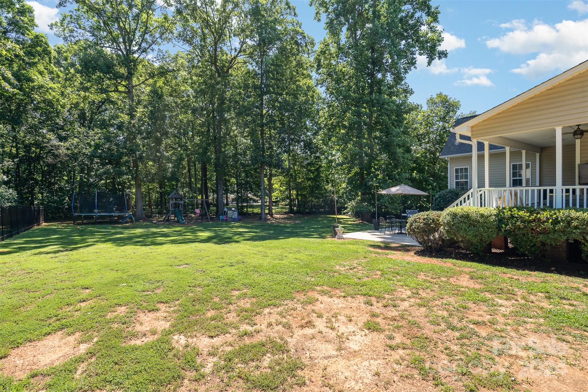 334 Adrian Road Salisbury, NC 28146 - Photo 32 of 40 a view of a house with backyard and sitting area