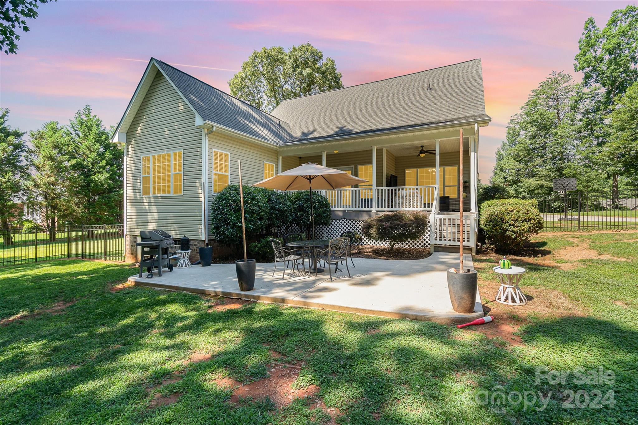 334 Adrian Road Salisbury, NC 28146 - Photo 33 of 40 a view of a house with backyard sitting area and garden