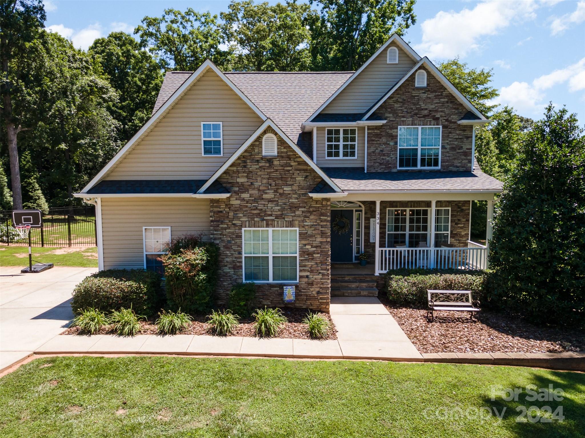 334 Adrian Road Salisbury, NC 28146 - Photo 4 of 40 a front view of a house with a yard