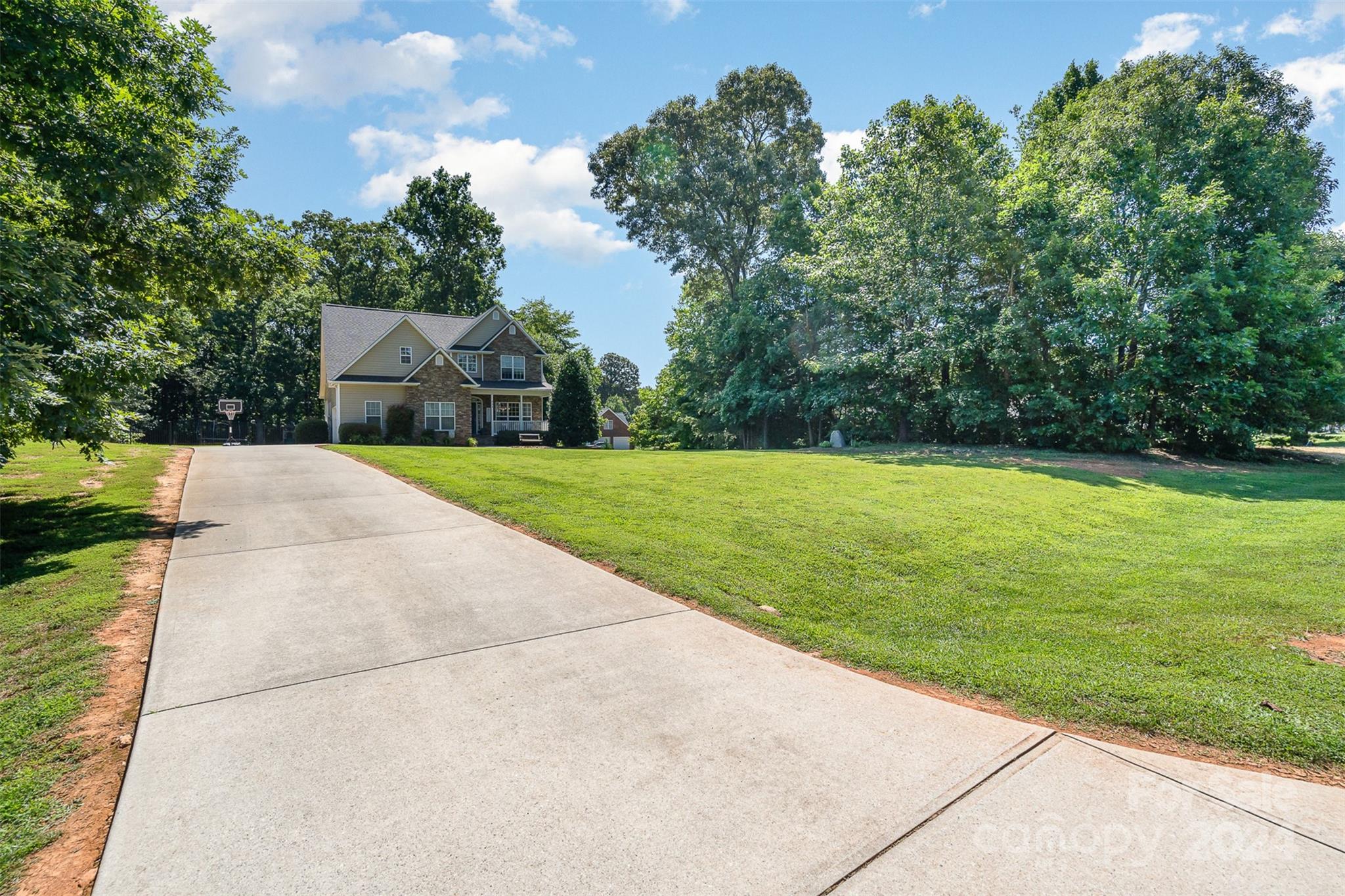 334 Adrian Road Salisbury, NC 28146 - Photo 5 of 40 a view of a garden with a fountain