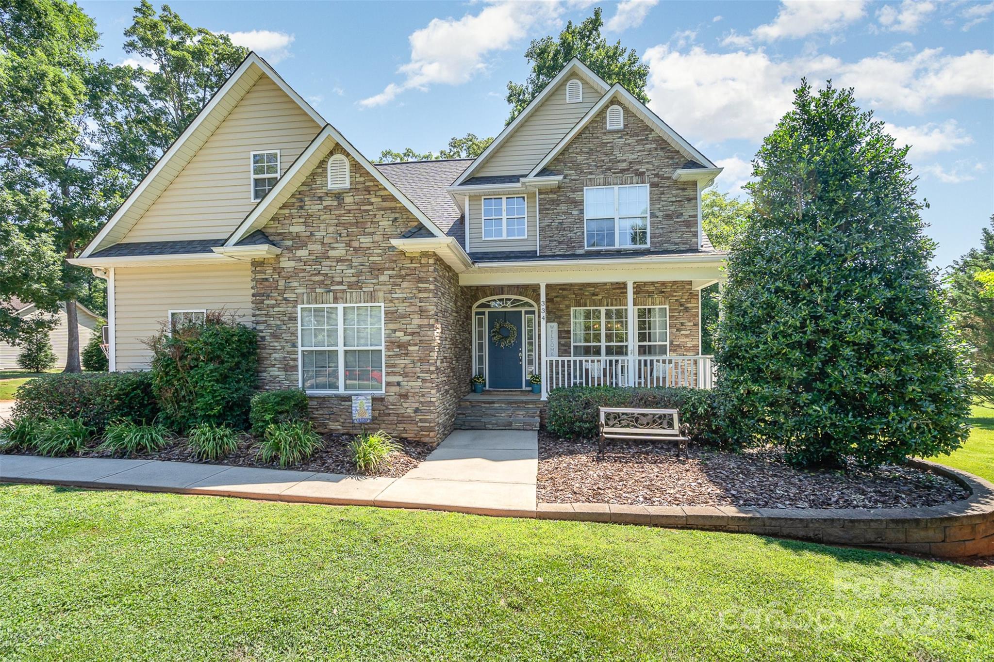 334 Adrian Road Salisbury, NC 28146 - Photo 7 of 40 a front view of a house with a yard