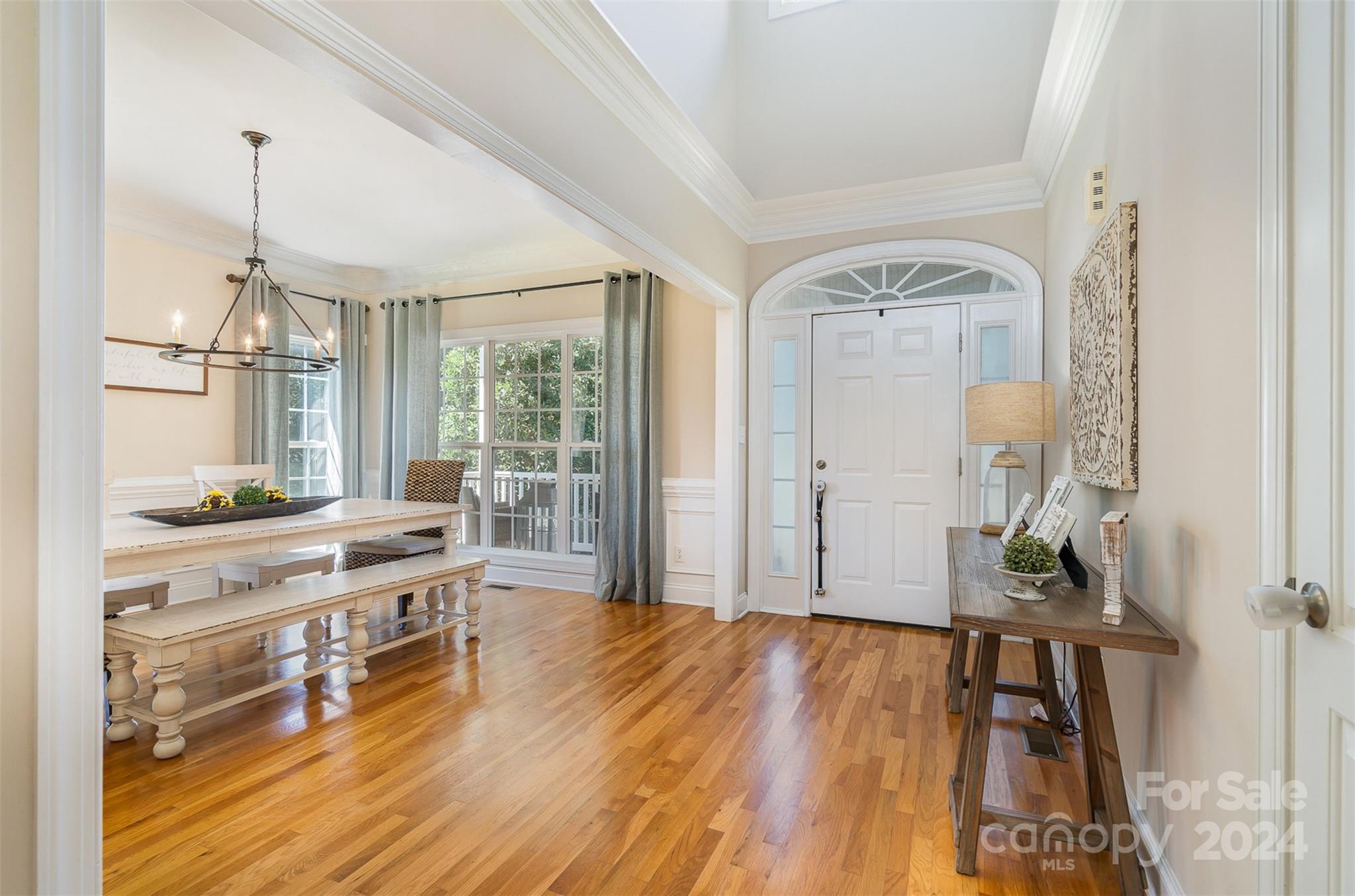 334 Adrian Road Salisbury, NC 28146 - Photo 10 of 40 a room with lots of wooden furniture and a chandelier