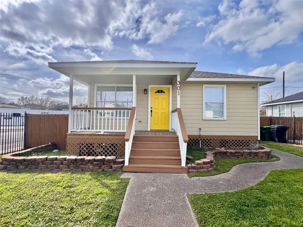 a front view of a house with swimming pool and porch