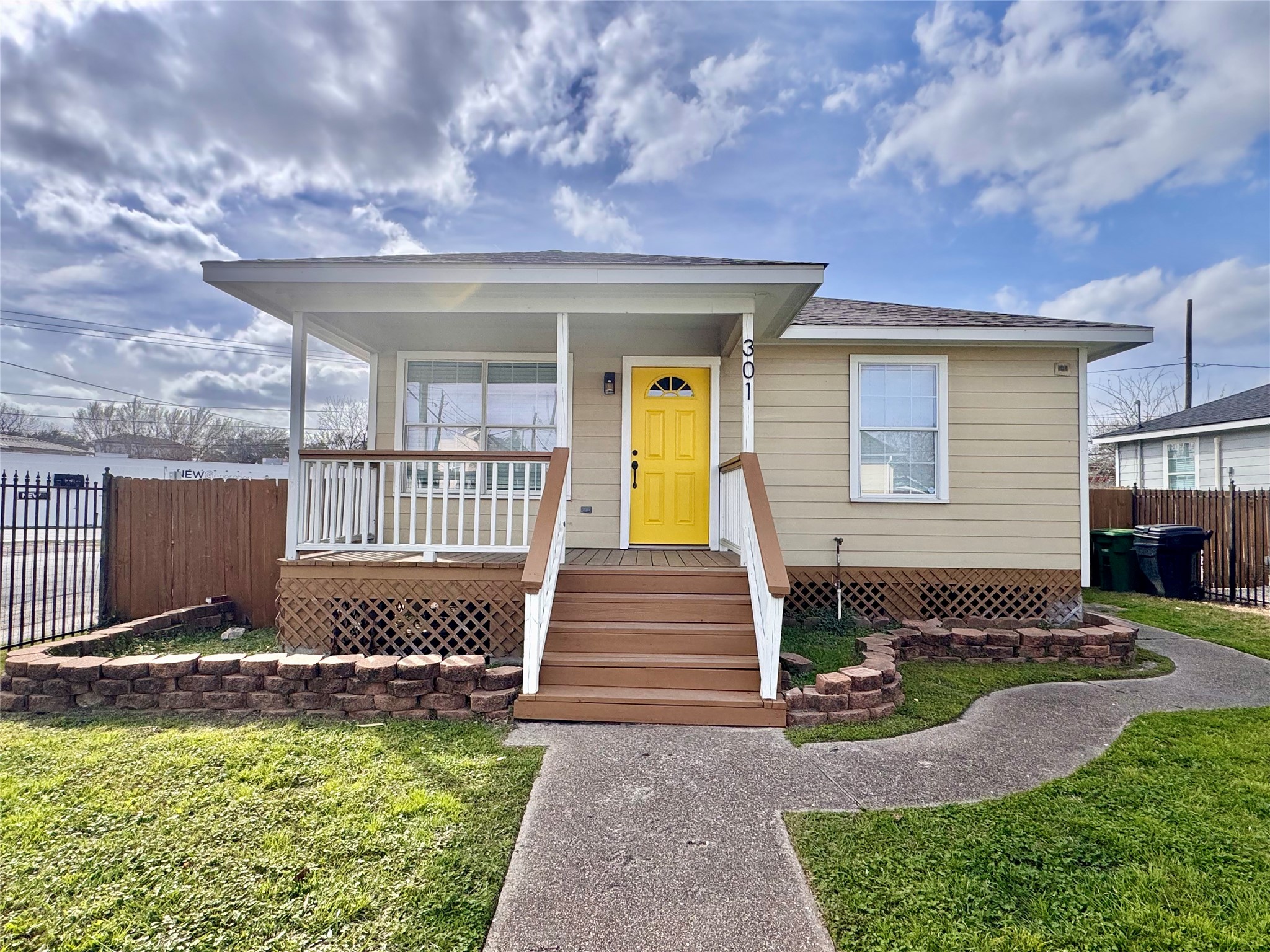 a front view of a house with swimming pool and porch