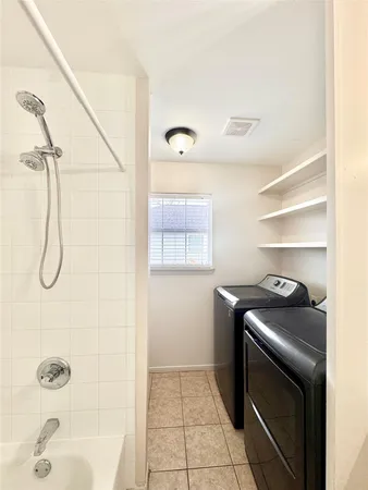 a utility room with washer and dryer