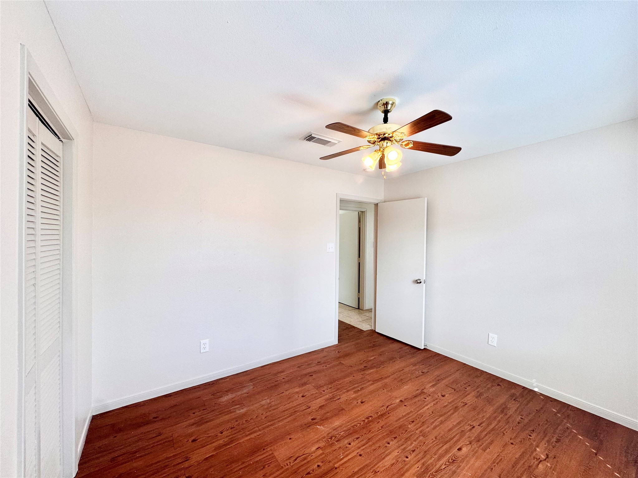 301 Enid Street Houston, TX 77009 - Photo 19 of 34 a view of an empty room with window and a ceiling fan