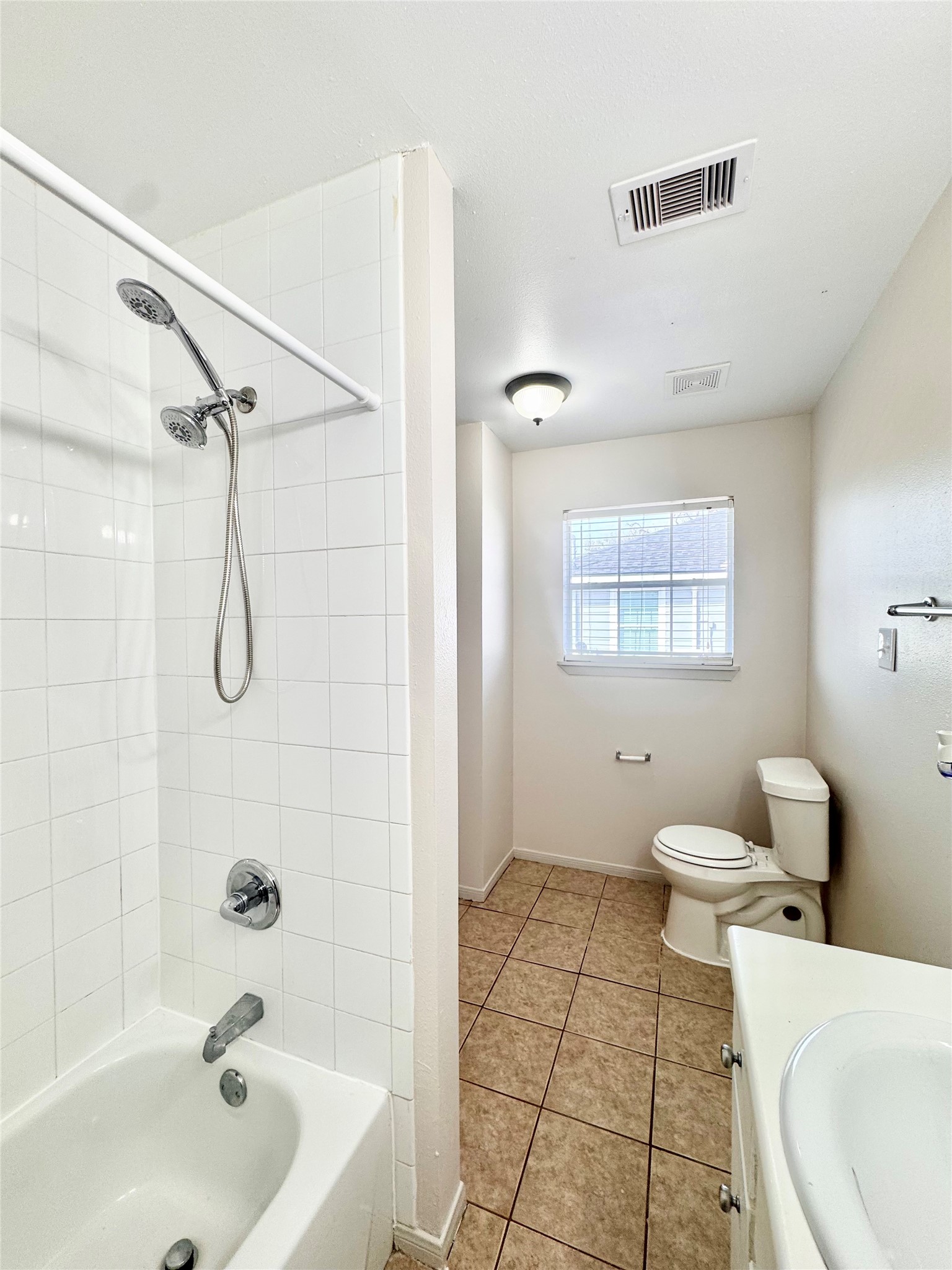 301 Enid Street Houston, TX 77009 - Photo 29 of 34 a bathroom with a toilet sink and shower
