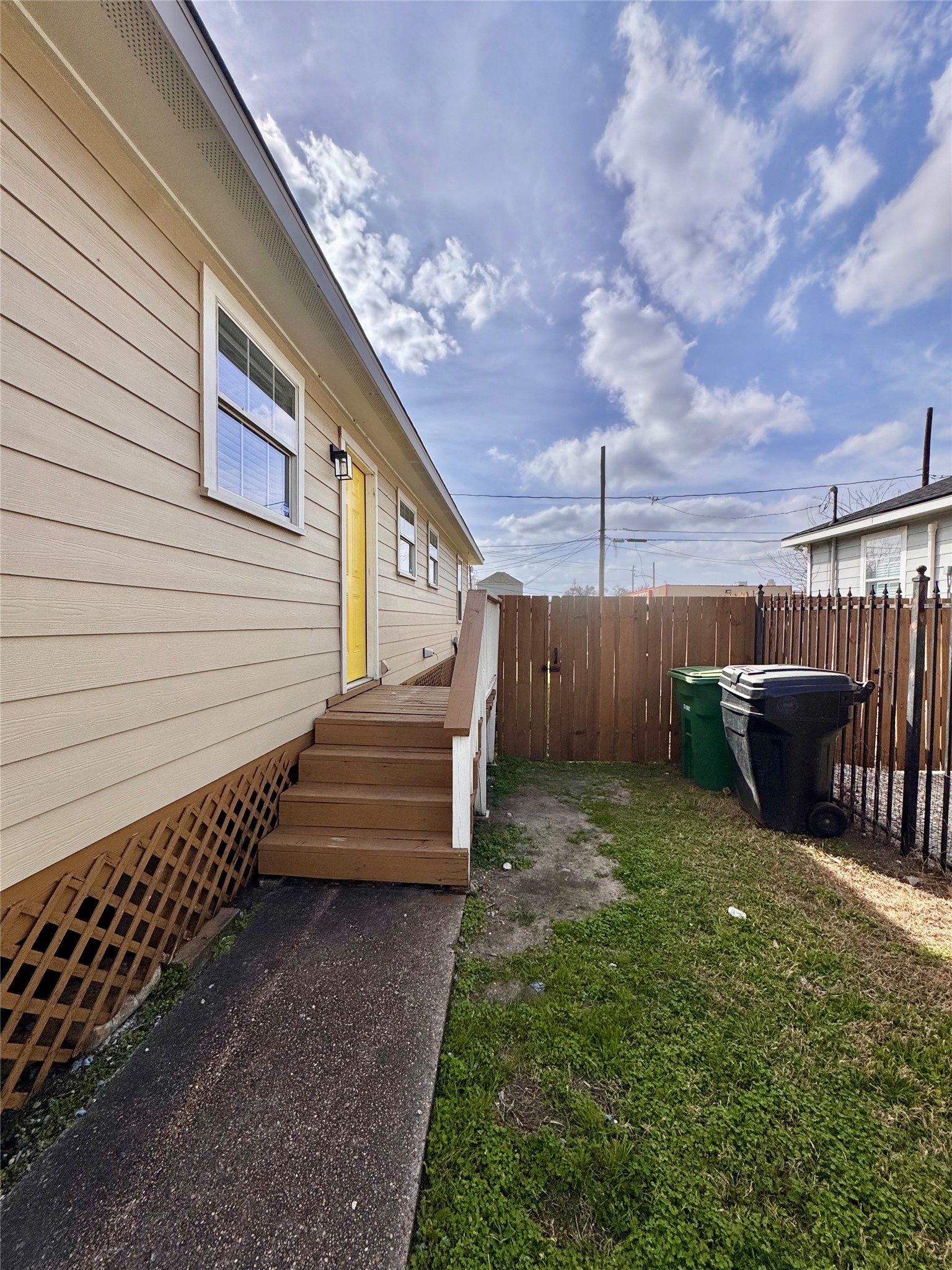 301 Enid Street Houston, TX 77009 - Photo 32 of 34 a view of a backyard with wooden fence