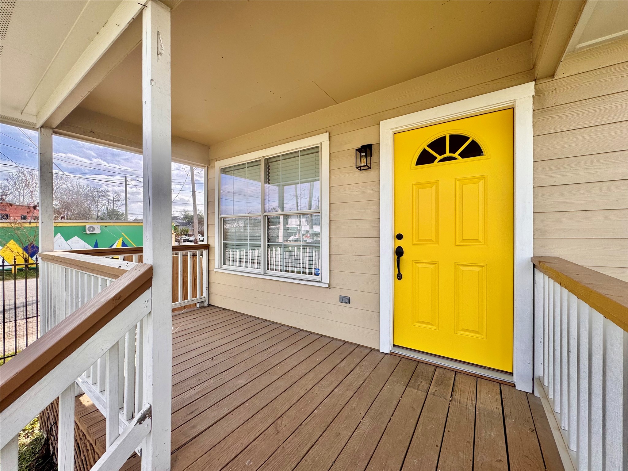 301 Enid Street Houston, TX 77009 - Photo 4 of 34 a view of a hallway with wooden floor and a outdoor space
