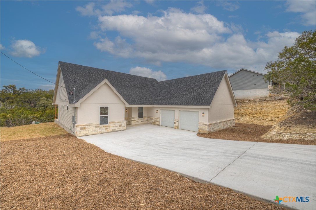 328 Compass Rose Spring Branch, TX 78070 - Photo 2 of 48 a view of a house with a yard