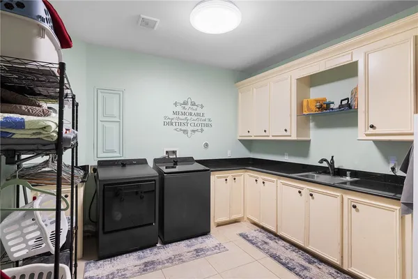a kitchen with stainless steel appliances granite countertop a sink and cabinets