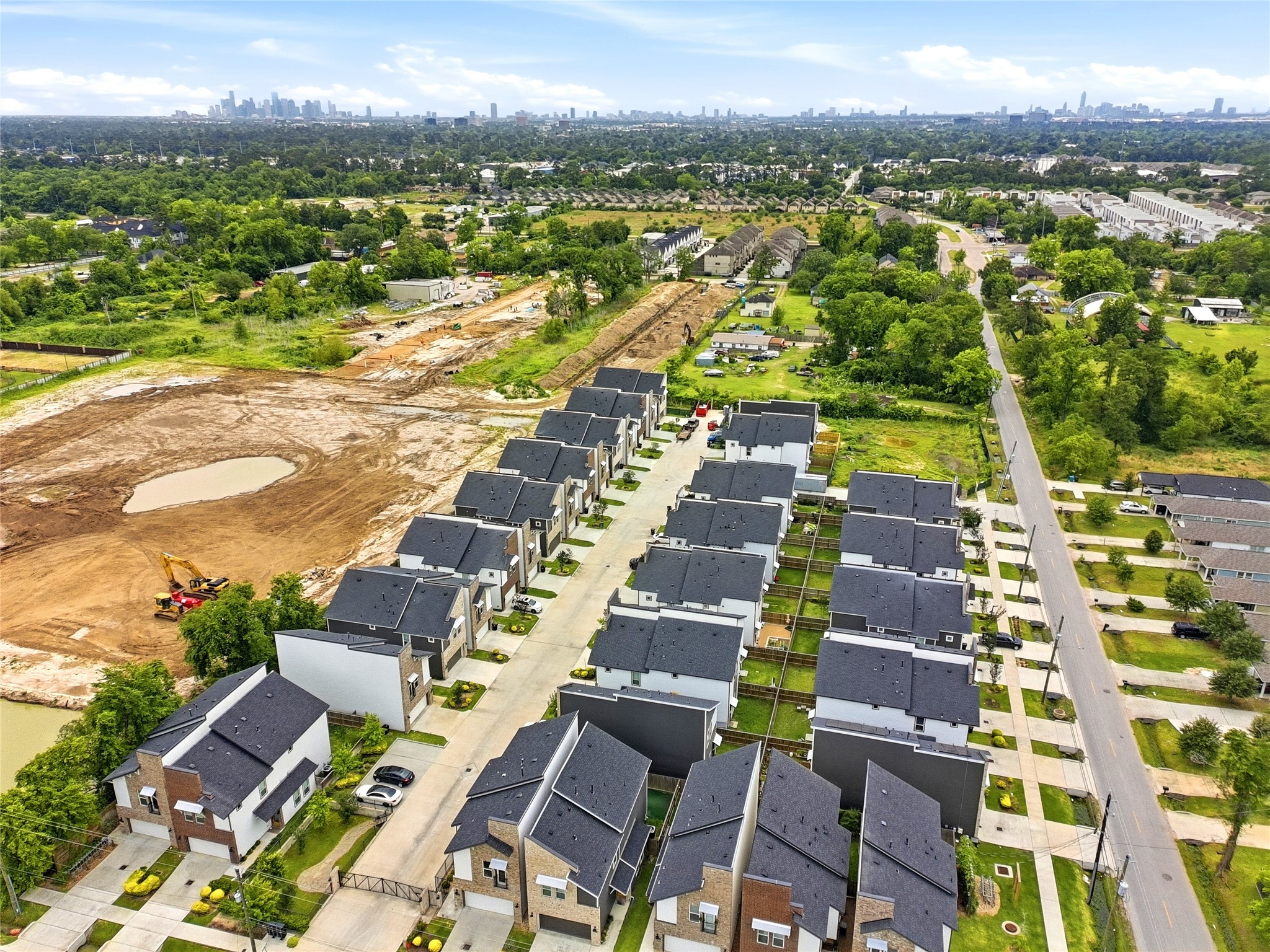 5814 Cebra Street Houston, TX 77091 - Photo 32 of 32 Expansive aerial capturing the gated neighborhood layout and proximity to Downtown Houston, The Heights and Galleria areas.