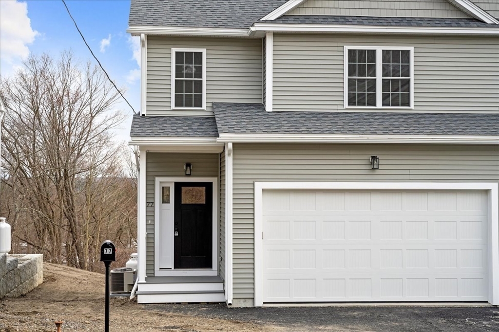 77 Upland Street Worcester, MA 01607 - Photo 1 of 1 a front view of a house with a empty space