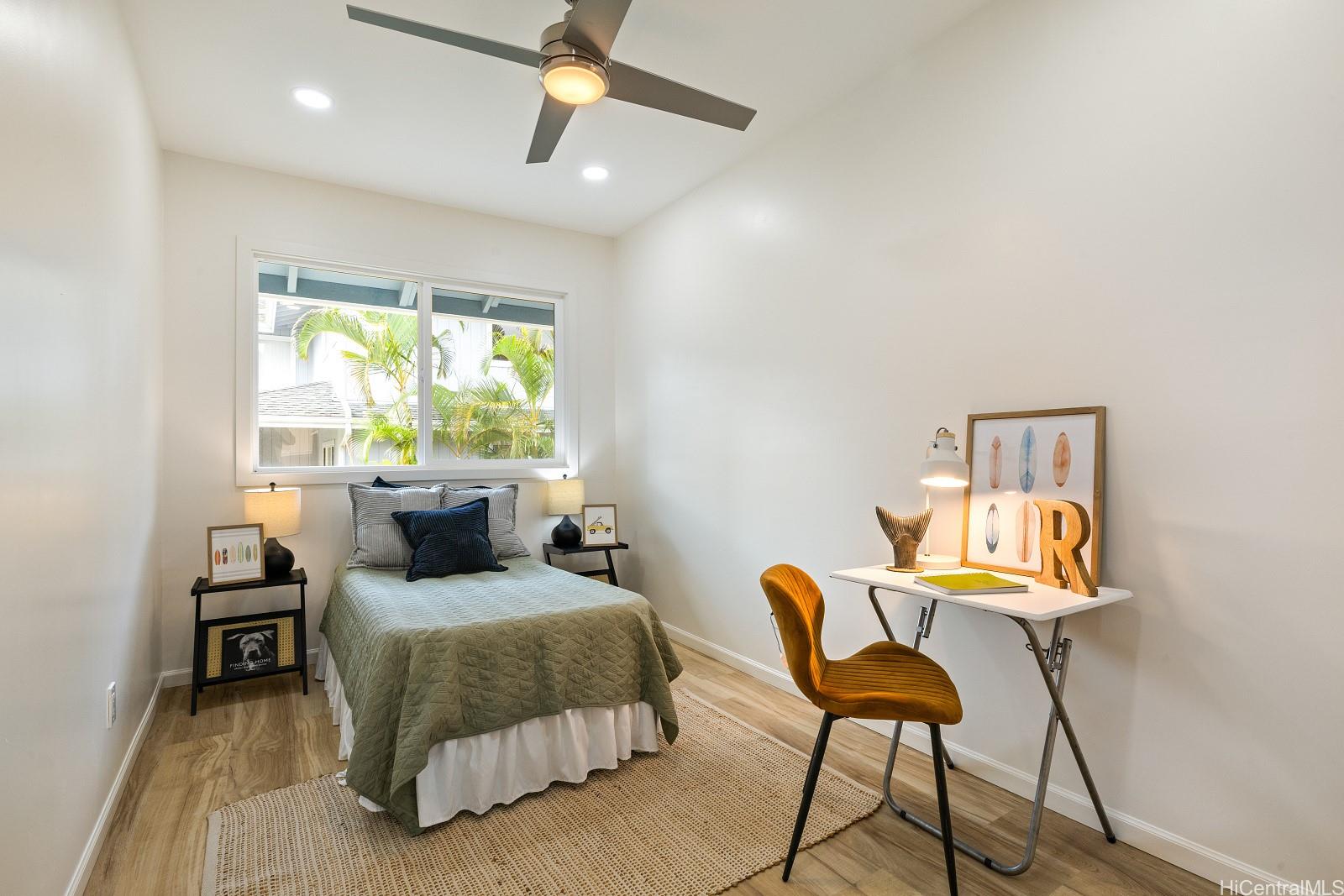 45-510 Mahinui Road, Unit B Kaneohe, HI 96744 - Photo 11 of 19 a bedroom with furniture and a window