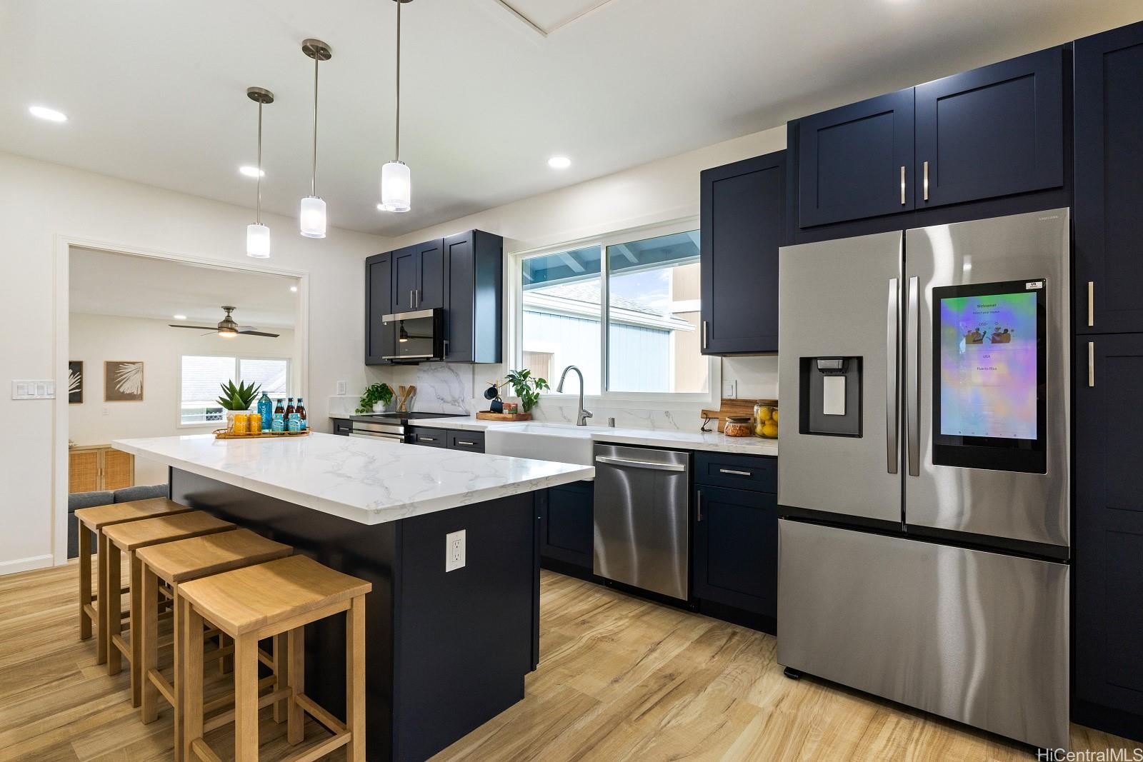 45-510 Mahinui Road, Unit B Kaneohe, HI 96744 - Photo 2 of 19 a kitchen with stainless steel appliances granite countertop a refrigerator a sink dishwasher a stove and a refrigerator
