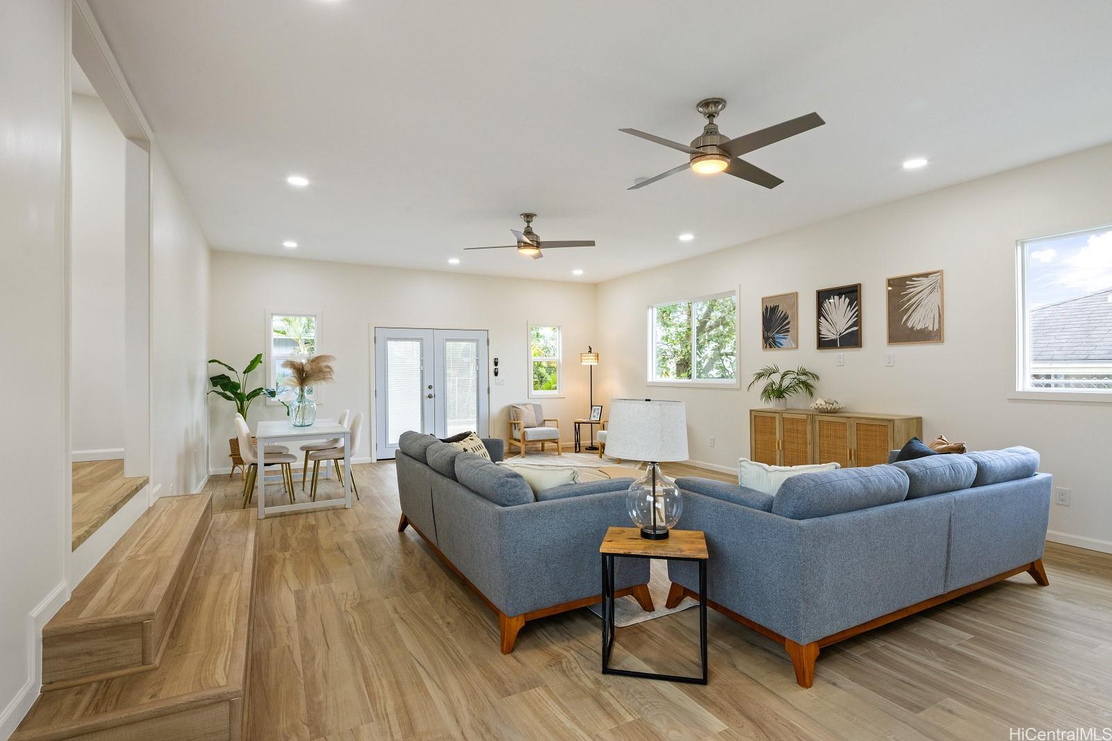 45-510 Mahinui Road, Unit B Kaneohe, HI 96744 - Photo 4 of 19 a living room with furniture and a large window
