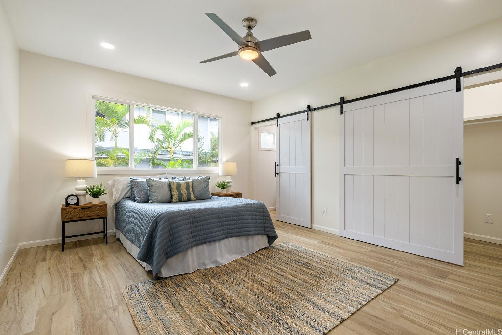 45-510 Mahinui Road, Unit B Kaneohe, HI 96744 - Photo 7 of 19 a bedroom with a bed and a large window