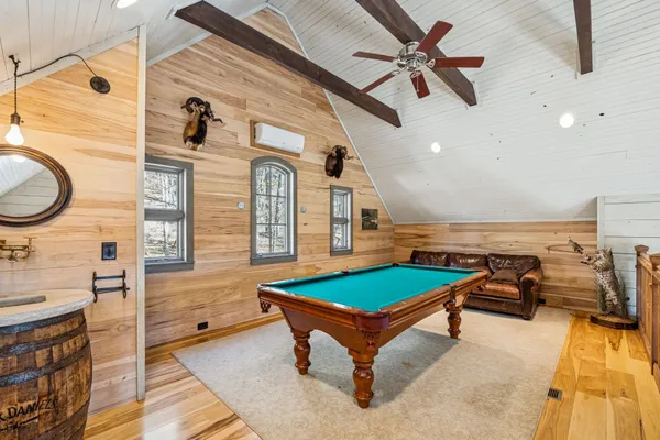 a room with lots of furniture and windows