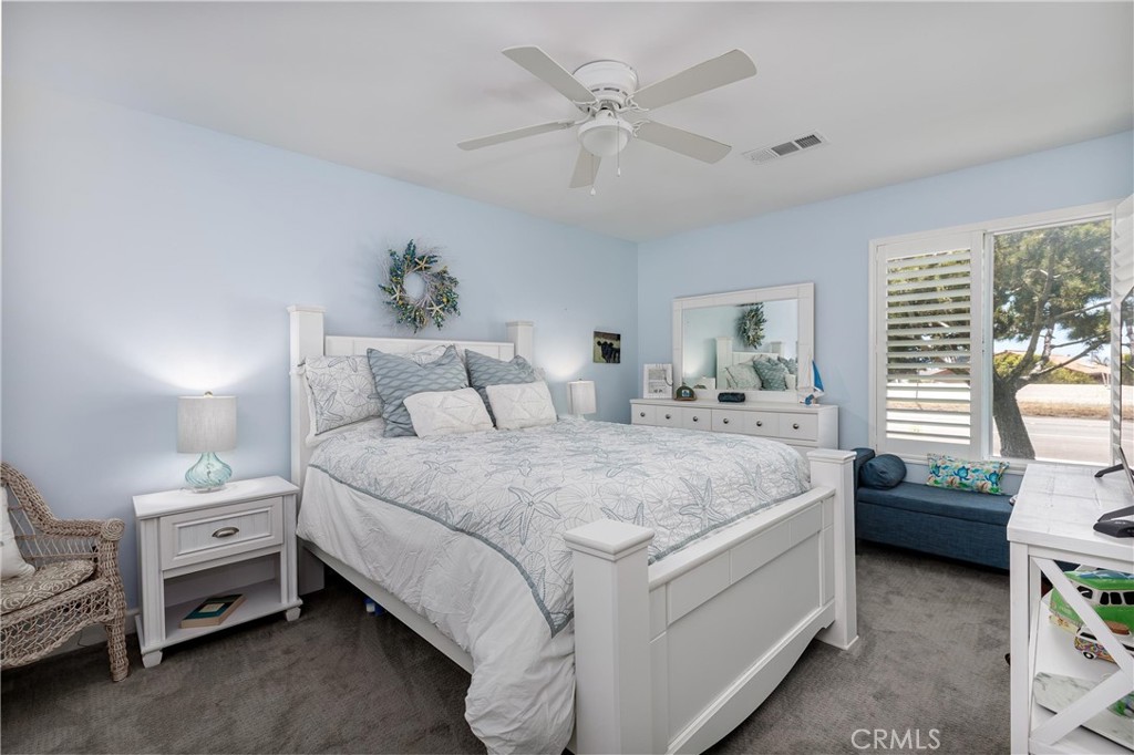 309 Sequoia Street, Unit 3 Morro Bay, CA 93442 - Photo 11 of 20 a spacious bedroom with a bed and a window