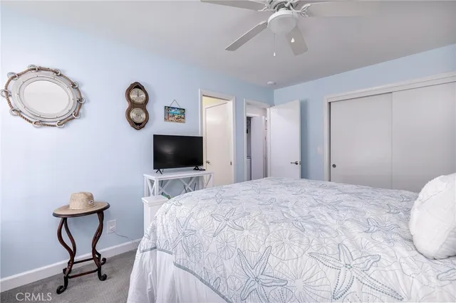 a bedroom with furniture and a window