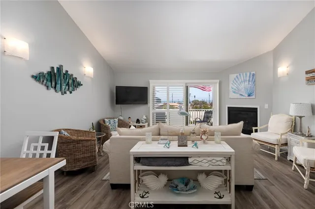 a kitchen with cabinets stainless steel appliances a sink and a window