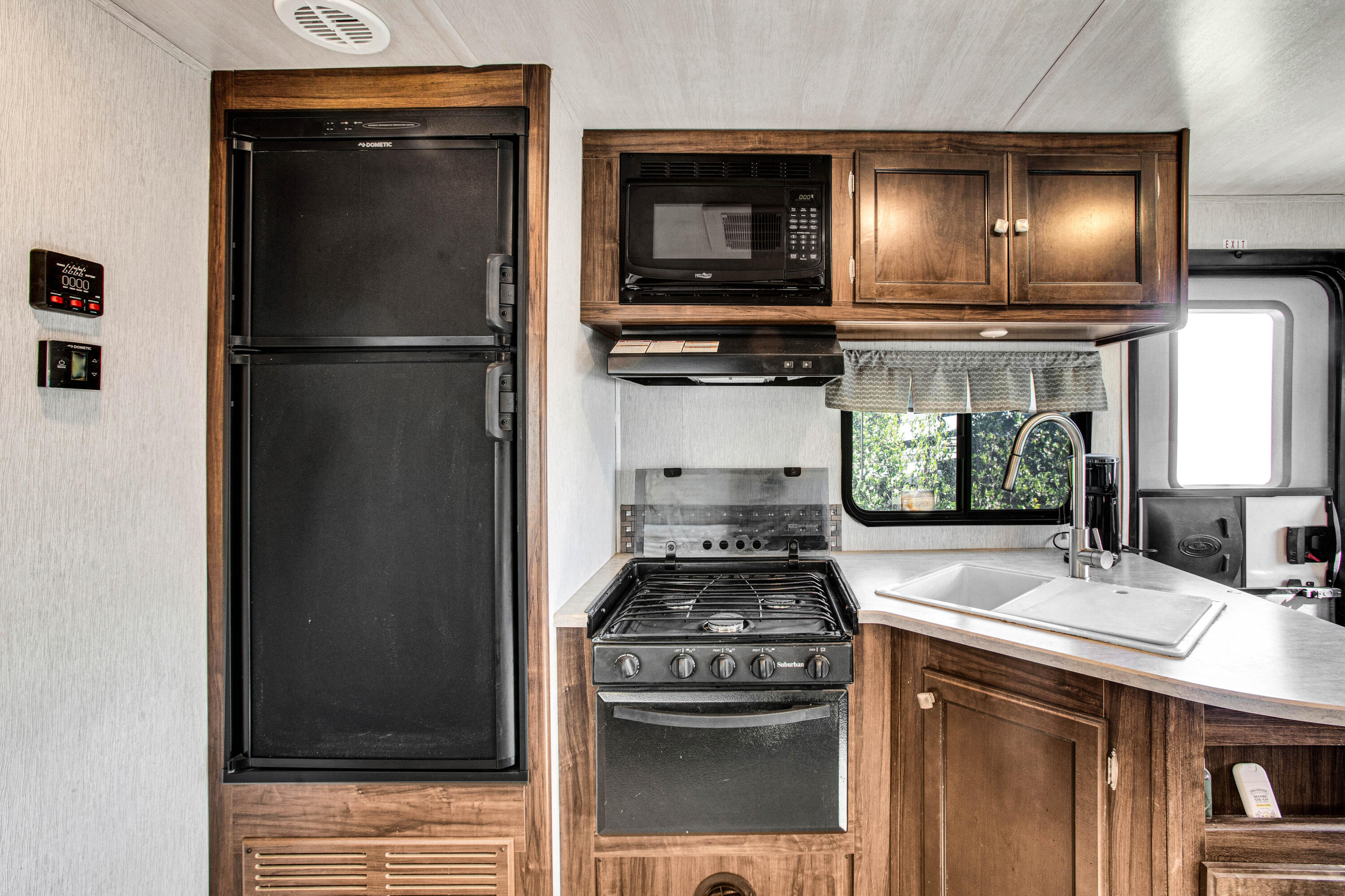 69411 Ramon Road, Unit 269 Cathedral City, CA 92234 - Photo 15 of 62 a kitchen with stainless steel appliances granite countertop a refrigerator and a sink