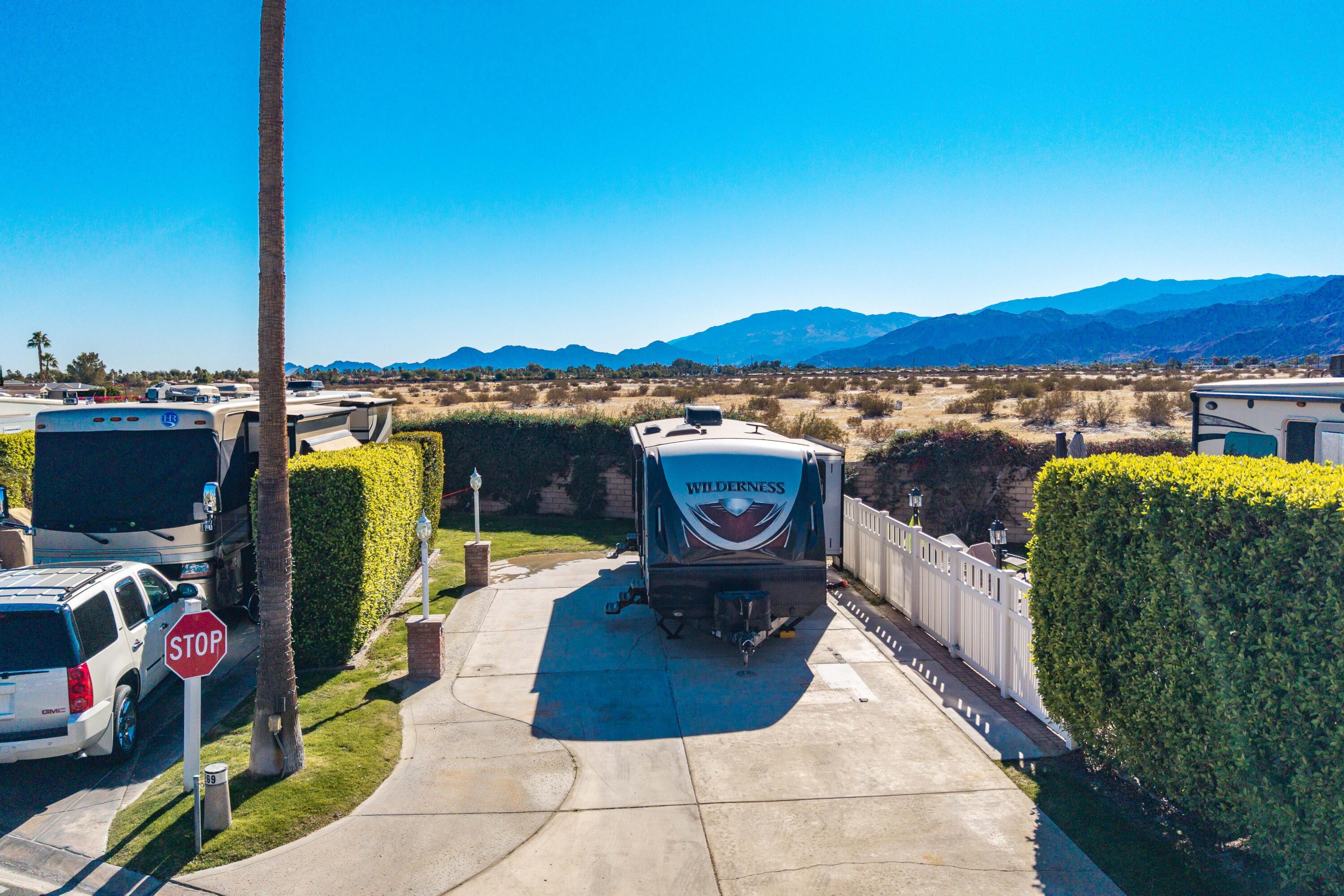 69411 Ramon Road, Unit 269 Cathedral City, CA 92234 - Photo 24 of 62 a view of a chairs and table on the terrace