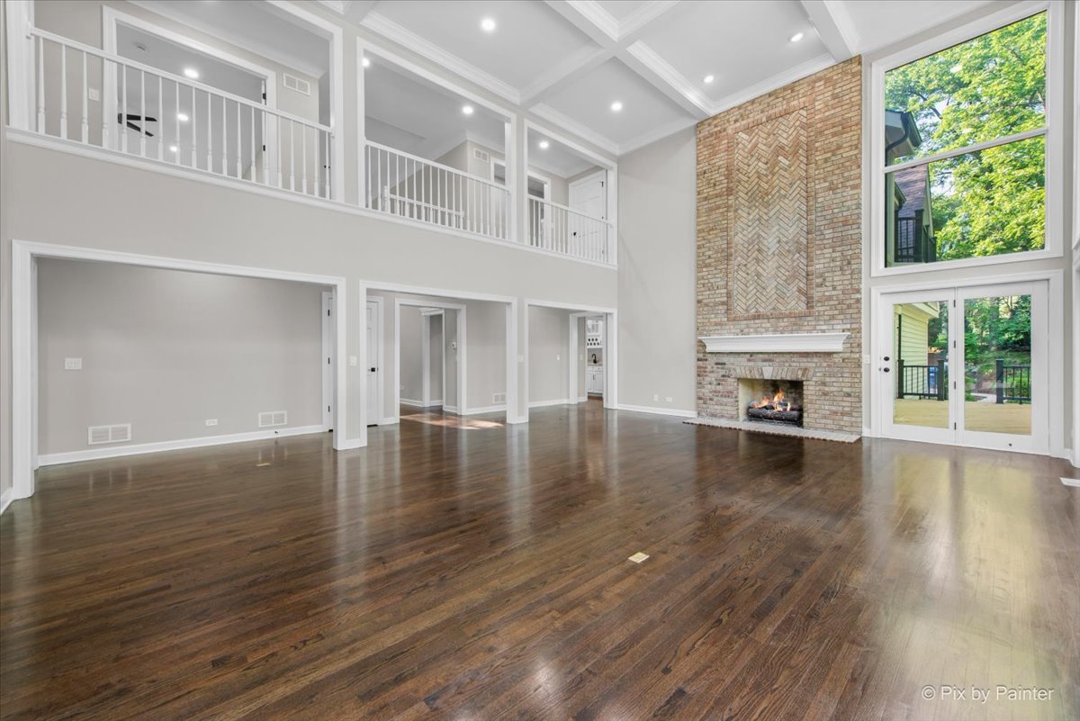 4N633 Hidden Oaks Road St. Charles, IL 60175 - Photo 16 of 49 a view of empty room with wooden floor and fireplace