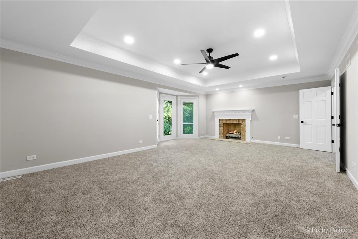 4N633 Hidden Oaks Road St. Charles, IL 60175 - Photo 27 of 49 an empty room with windows and fireplace