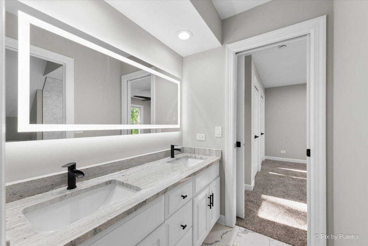 4N633 Hidden Oaks Road St. Charles, IL 60175 - Photo 34 of 49 a bathroom with a sink and a mirror
