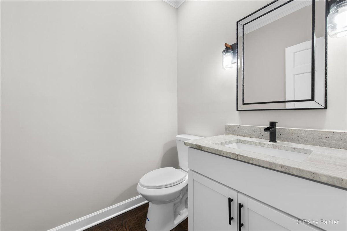 4N633 Hidden Oaks Road St. Charles, IL 60175 - Photo 41 of 49 a bathroom with a granite countertop toilet sink mirror and vanity