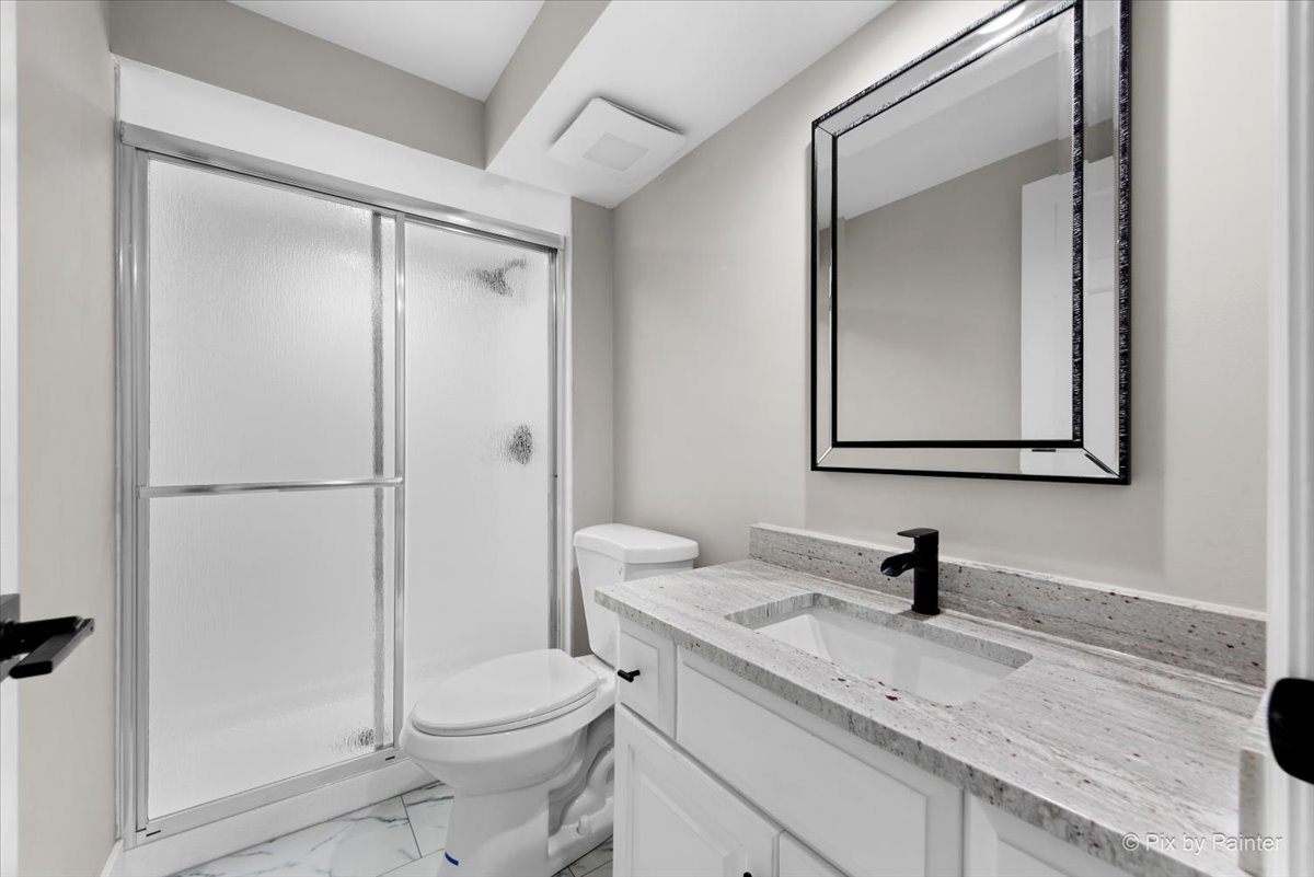 4N633 Hidden Oaks Road St. Charles, IL 60175 - Photo 48 of 49 a bathroom with a granite countertop toilet sink and mirror