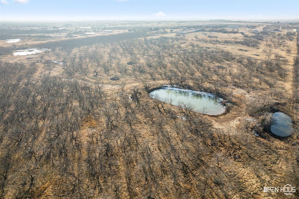8620 Seymour Highway, Unit R Wichita Falls, TX 76310 - Photo 21 of 22 a view of a lake from a yard