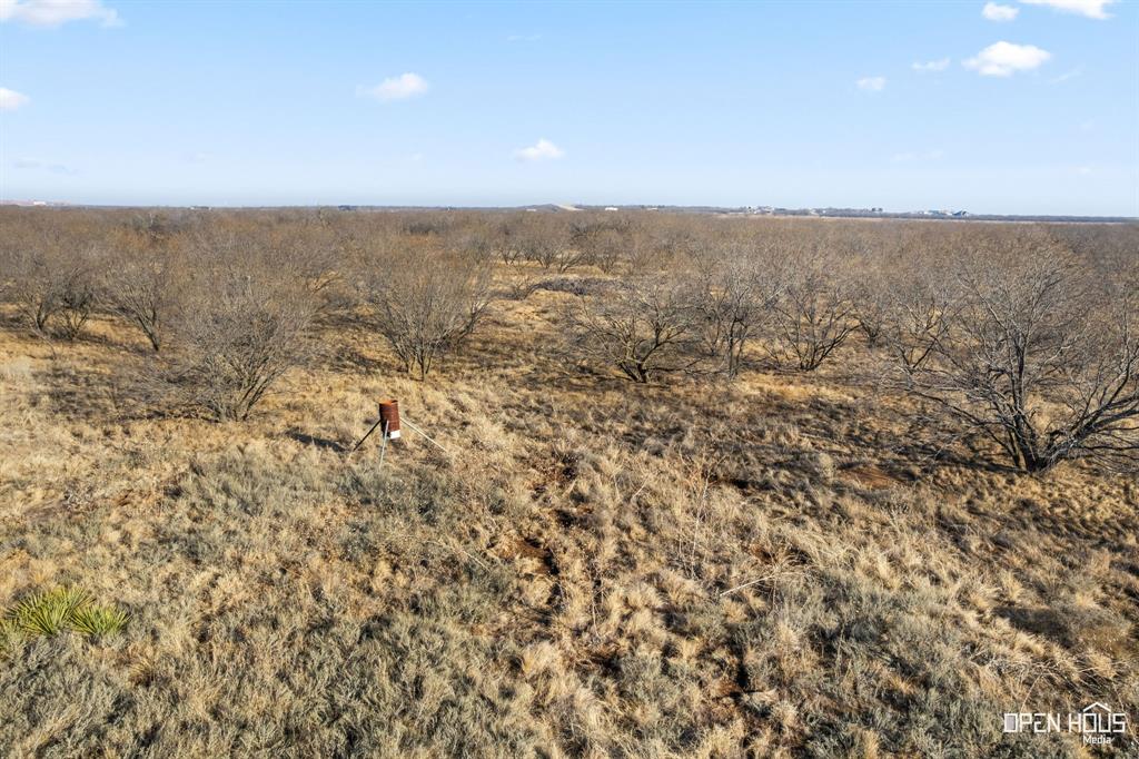 8620 Seymour Highway, Unit R Wichita Falls, TX 76310 - Photo 22 of 22 an aerial view of house with yard and mountain view in back