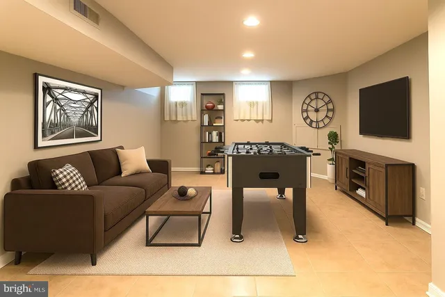 a living room with furniture a fireplace and a flat screen tv