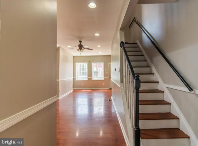 a view of an entryway with wooden floor