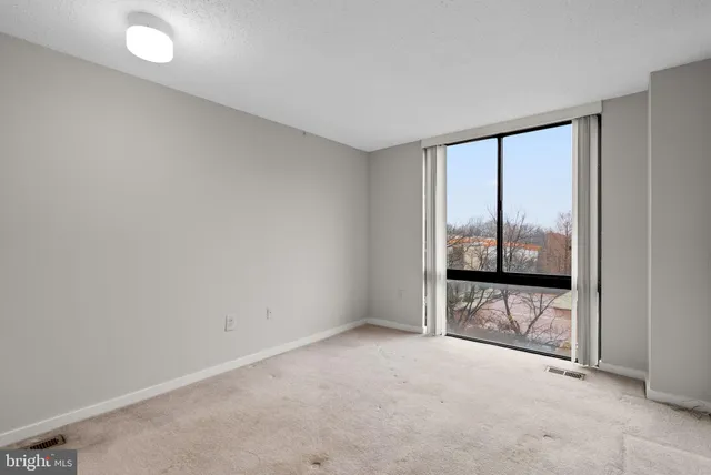 an empty room with sliding door