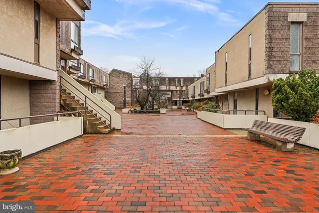 a view of a swimming pool with an outdoor seating and a yard