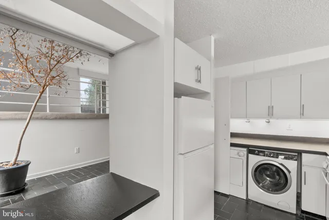 a view of a storage & utility room with washer and dryer