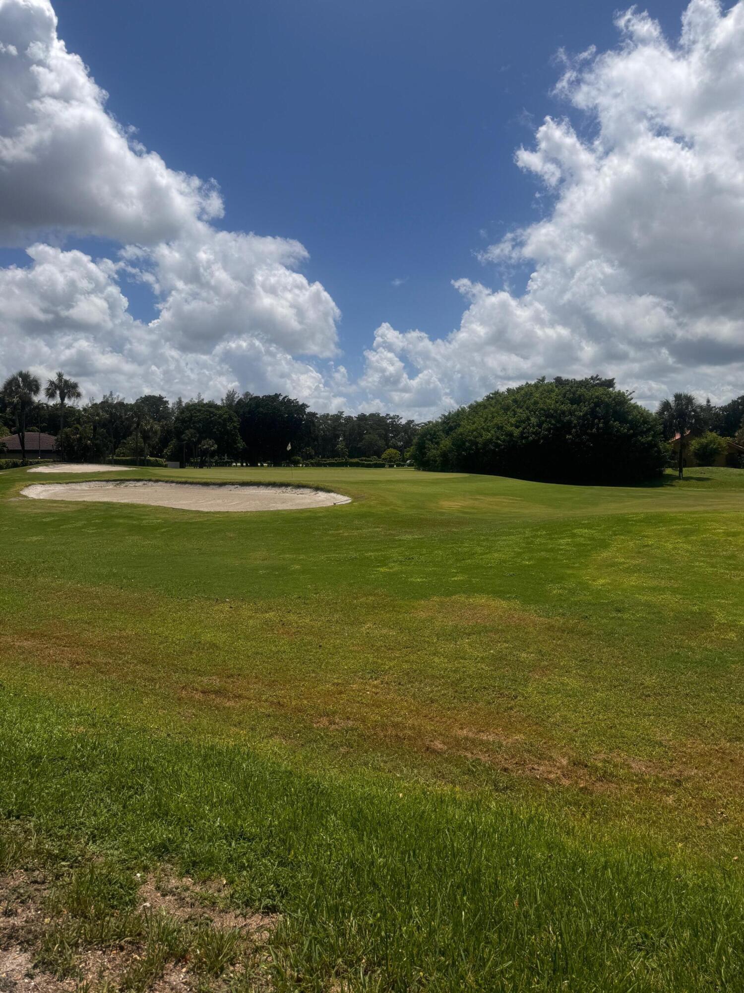 21411 Juego Circle, Unit 32B Boca Raton, FL 33433 - Photo 3 of 7 a view of an ocean from a yard