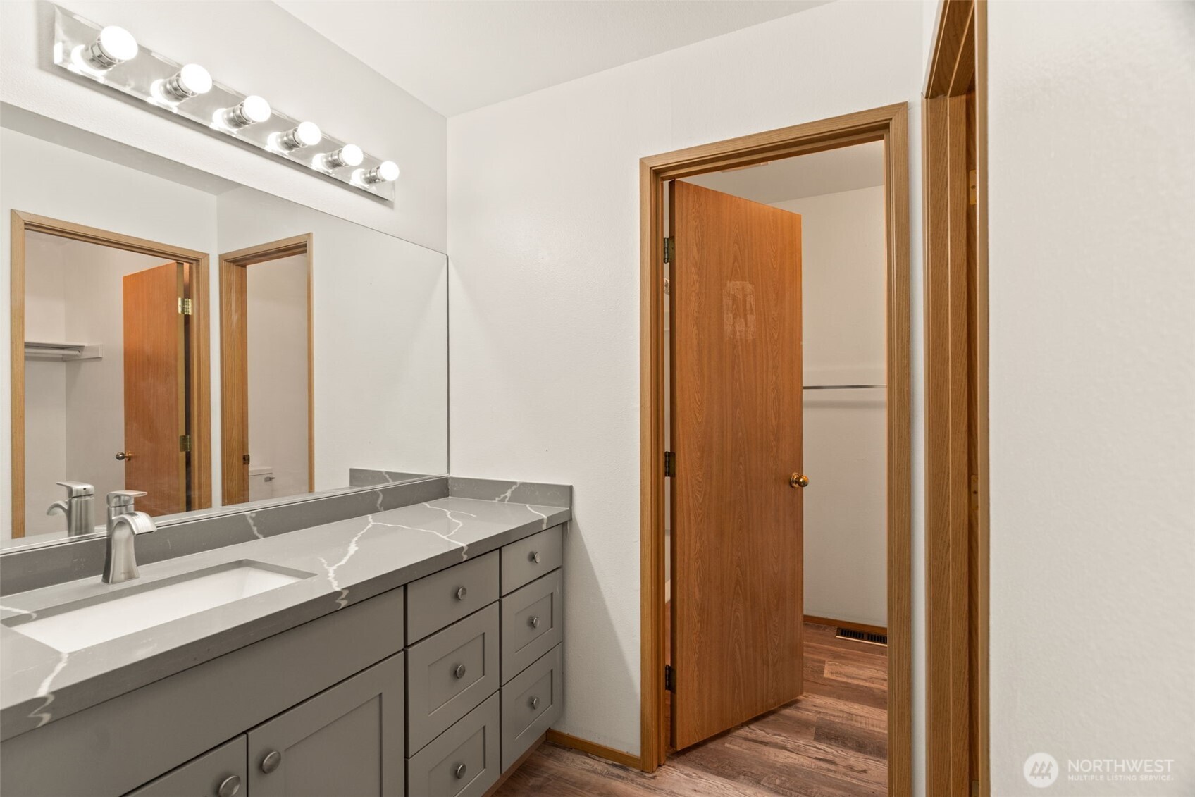 4021 167th Street Northeast, Unit A Arlington, WA 98223 - Photo 13 of 23 a bathroom with a double vanity sink and a mirror