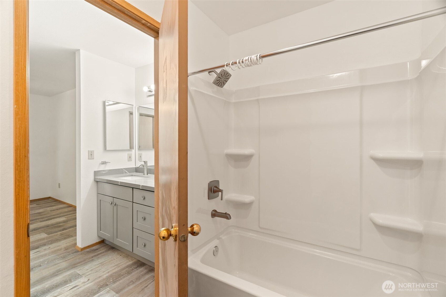 4021 167th Street Northeast, Unit A Arlington, WA 98223 - Photo 15 of 23 a bathroom with a tub shower vanity and a sink