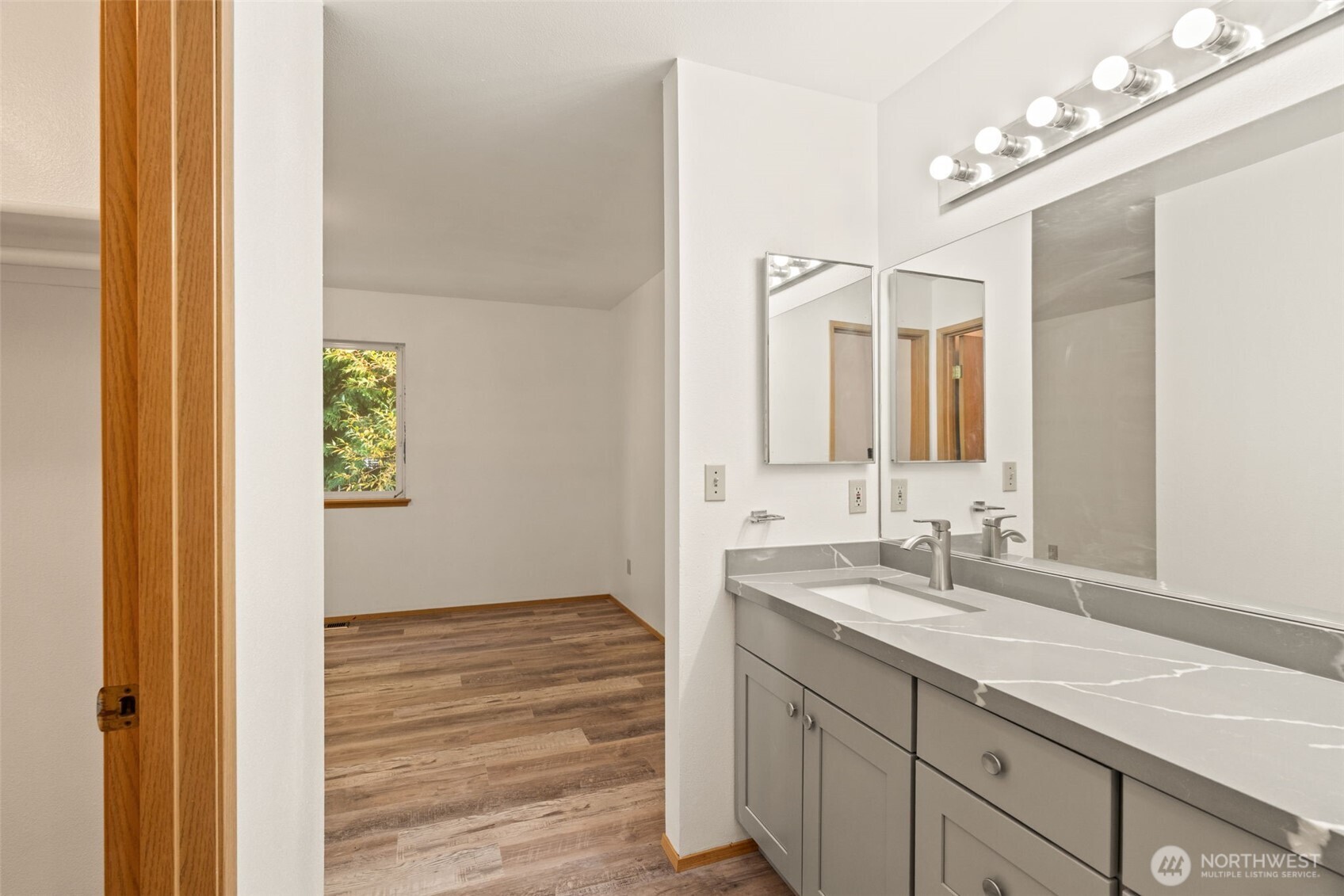 4021 167th Street Northeast, Unit A Arlington, WA 98223 - Photo 16 of 23 a bathroom with a sink and a mirror