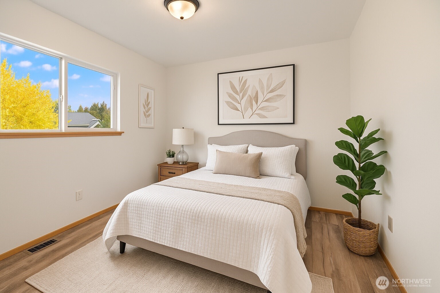 4021 167th Street Northeast, Unit A Arlington, WA 98223 - Photo 19 of 23 a bedroom with bed and a painting on the wall