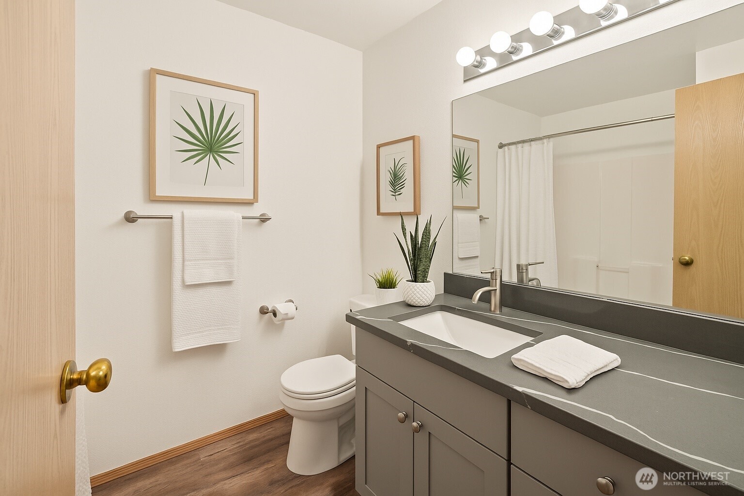 4021 167th Street Northeast, Unit A Arlington, WA 98223 - Photo 20 of 23 a bathroom with a granite countertop sink a toilet and a mirror