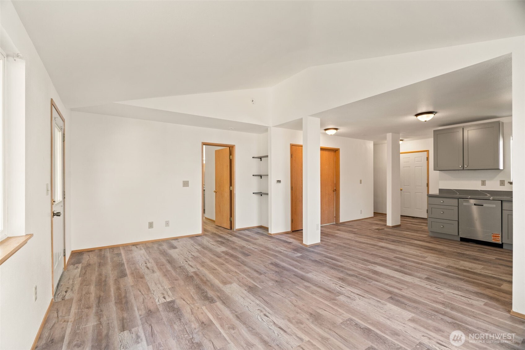4021 167th Street Northeast, Unit A Arlington, WA 98223 - Photo 9 of 23 a view of a kitchen with a refrigerator and a stove