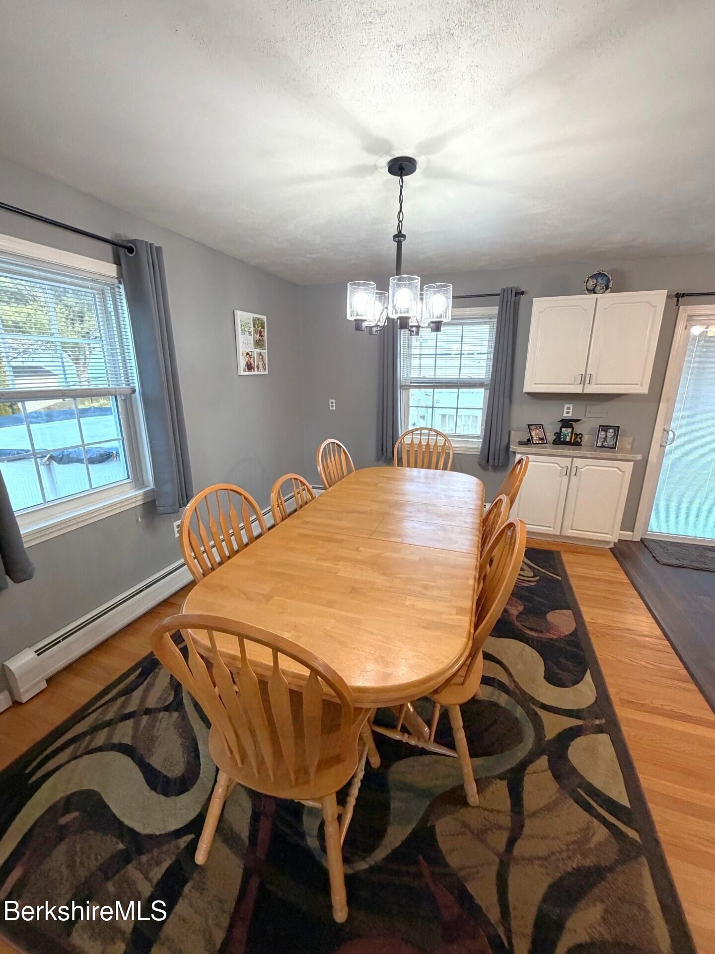 8 Country Road Adams, MA 01220 - Photo 12 of 44 a view of a dining room with furniture and wooden floor
