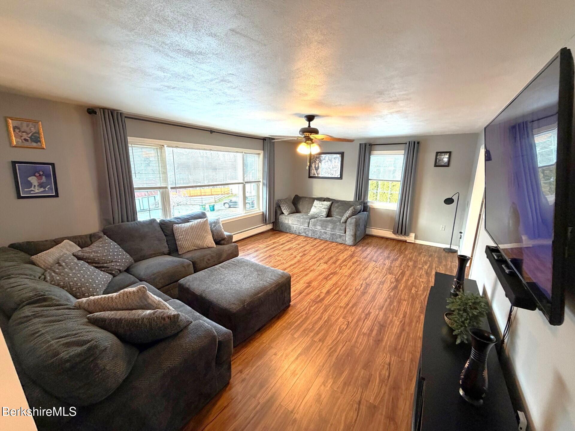 8 Country Road Adams, MA 01220 - Photo 13 of 44 a living room with furniture and a flat screen tv