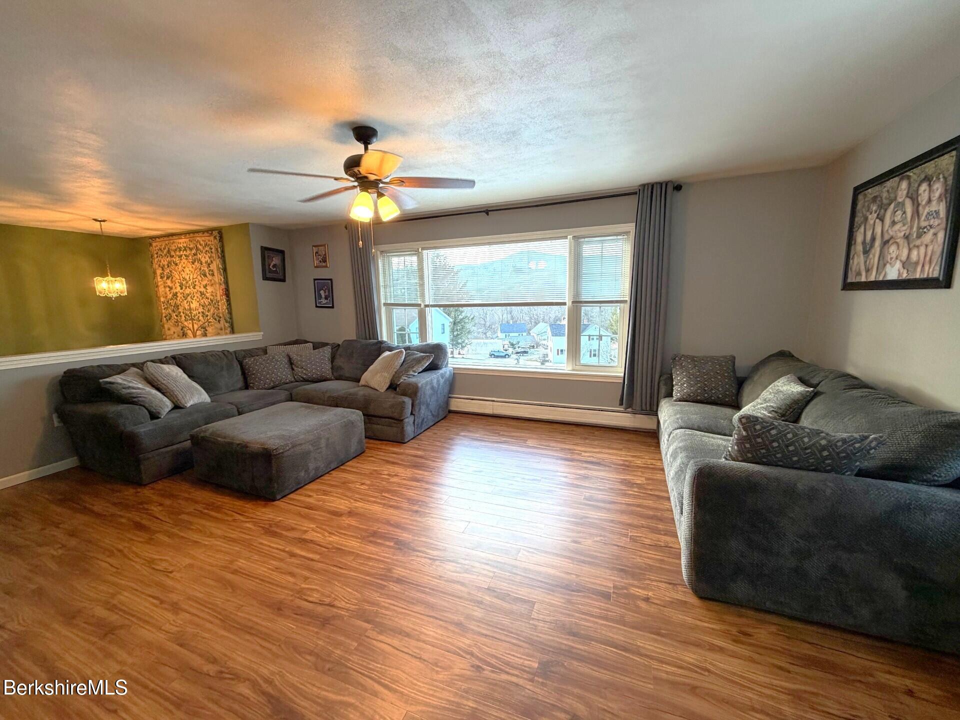 8 Country Road Adams, MA 01220 - Photo 15 of 44 a living room with furniture and a large window