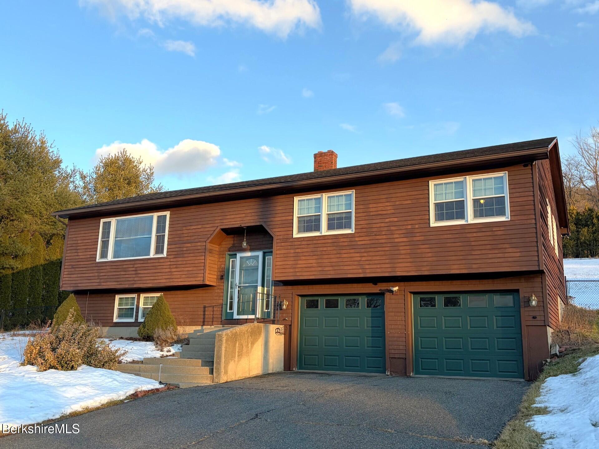 8 Country Road Adams, MA 01220 - Photo 2 of 44 a front view of a house with a yard and garage